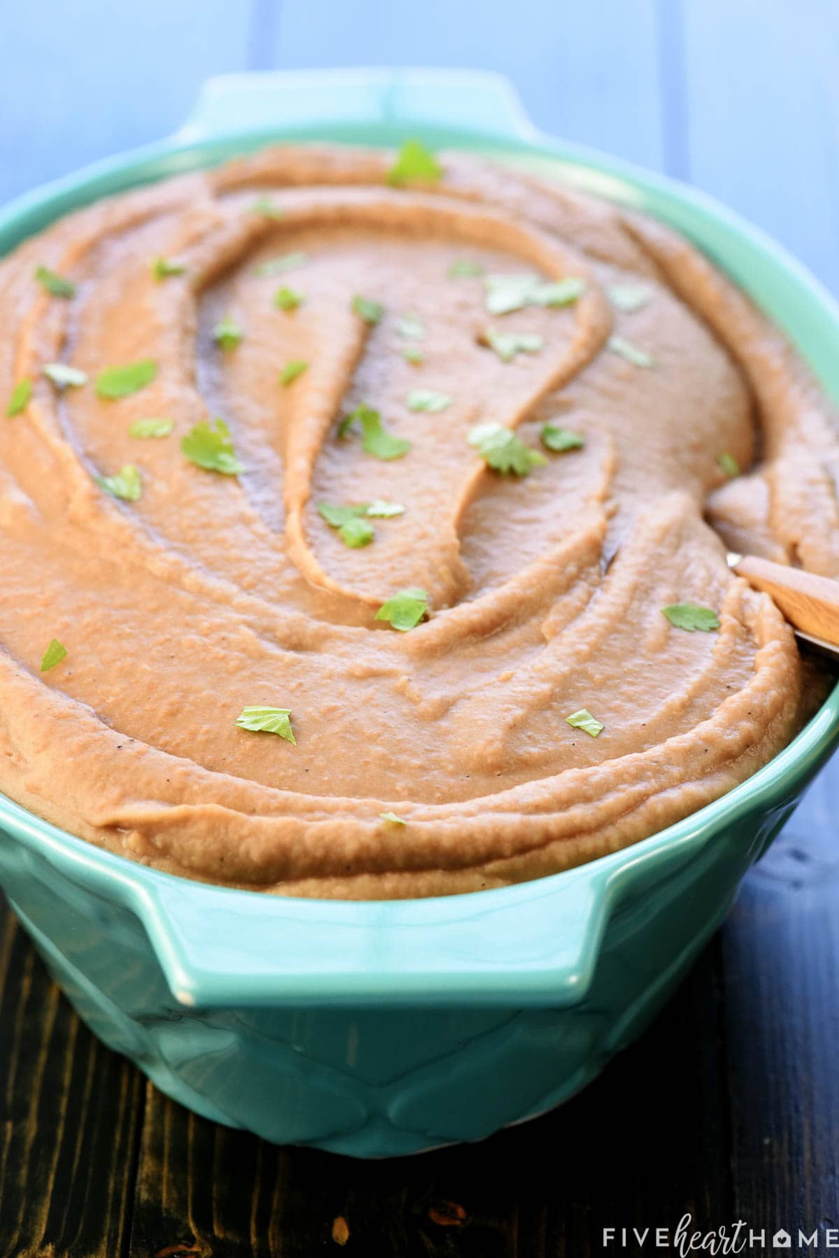 Instant Pot Refried Beans garnished with cilantro.