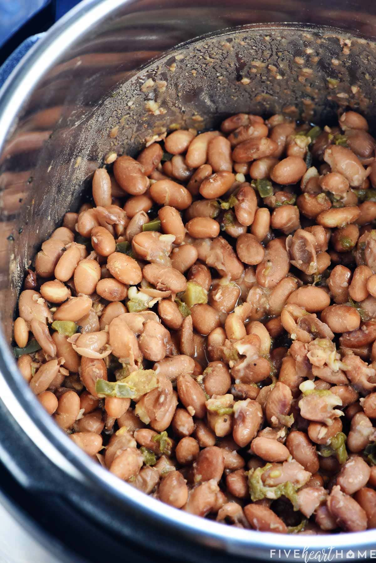 Refried beans instant pot showing cooked pinto beans.