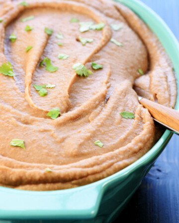 Instant Pot Refried Beans with garnish.