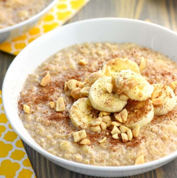 Peanut Butter Banana Oatmeal in a bowl garnished with toppings.