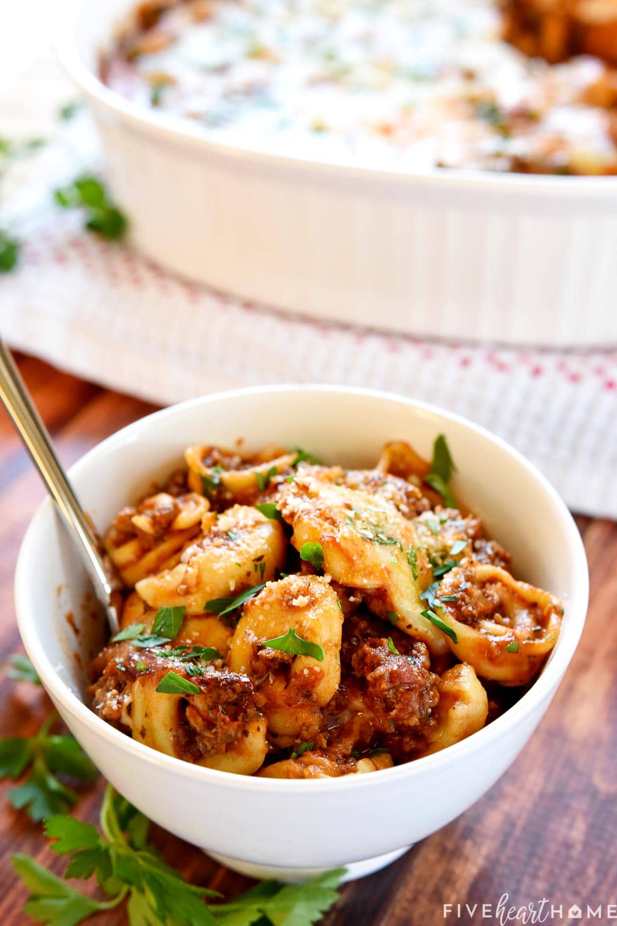 Baked Tortellini in white bowl.