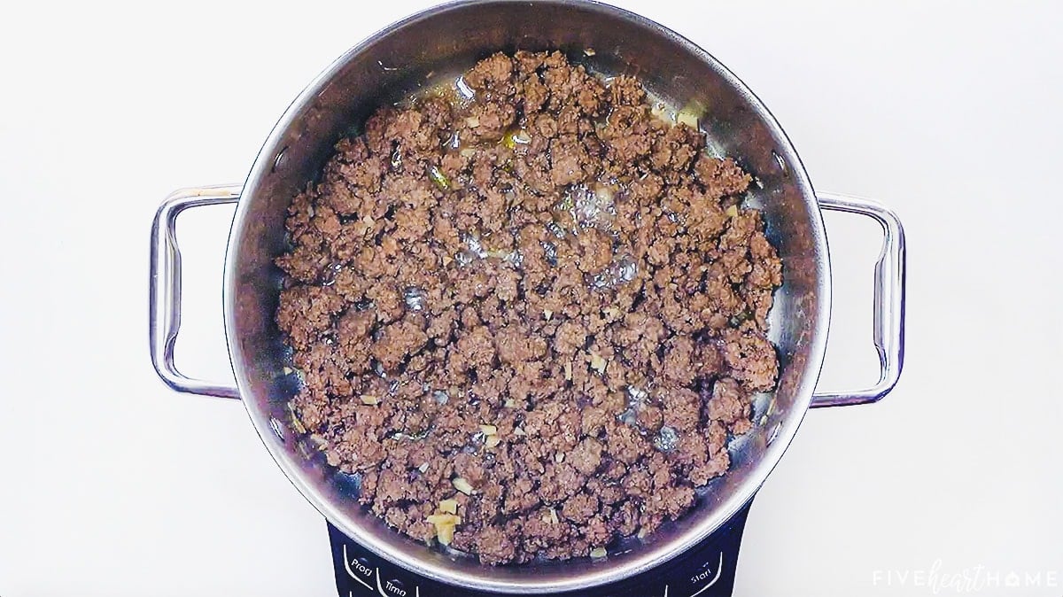 Cooking ground beef in a pot.