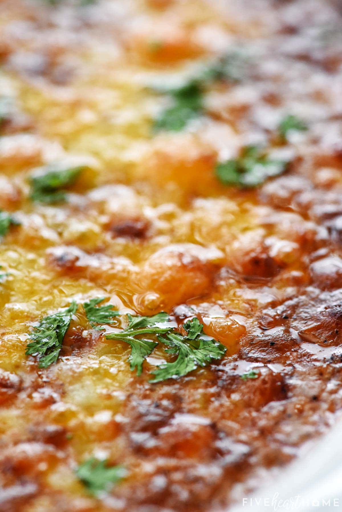 Close-up of bubbling cheese on Beef Enchilada Dip.
