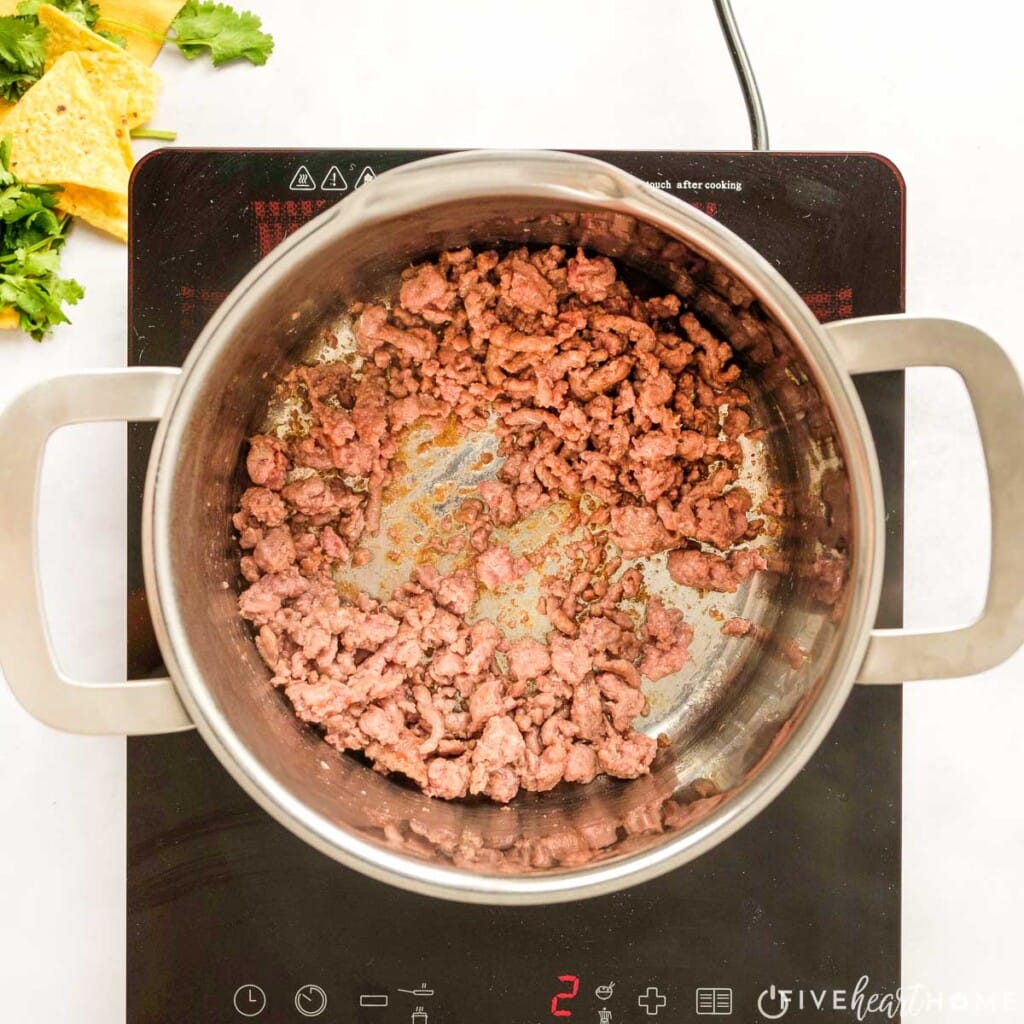 Browning ground beef in pot.