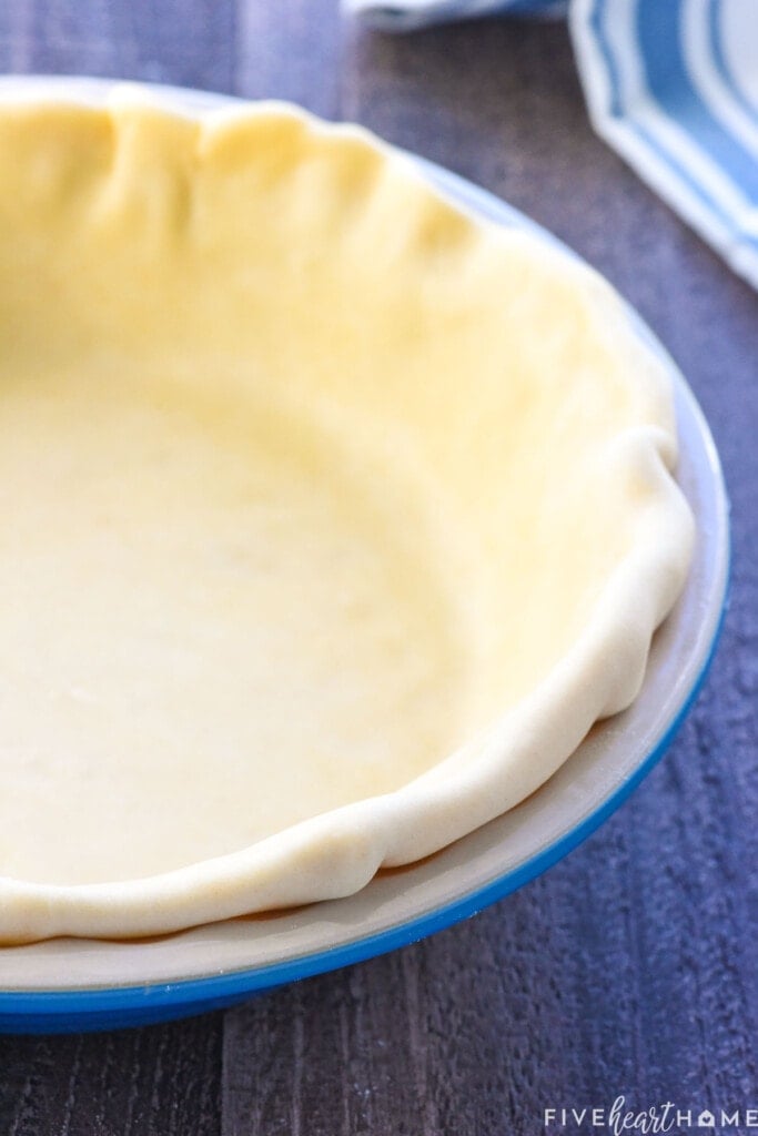 How to make pie crust and fold under the edges.