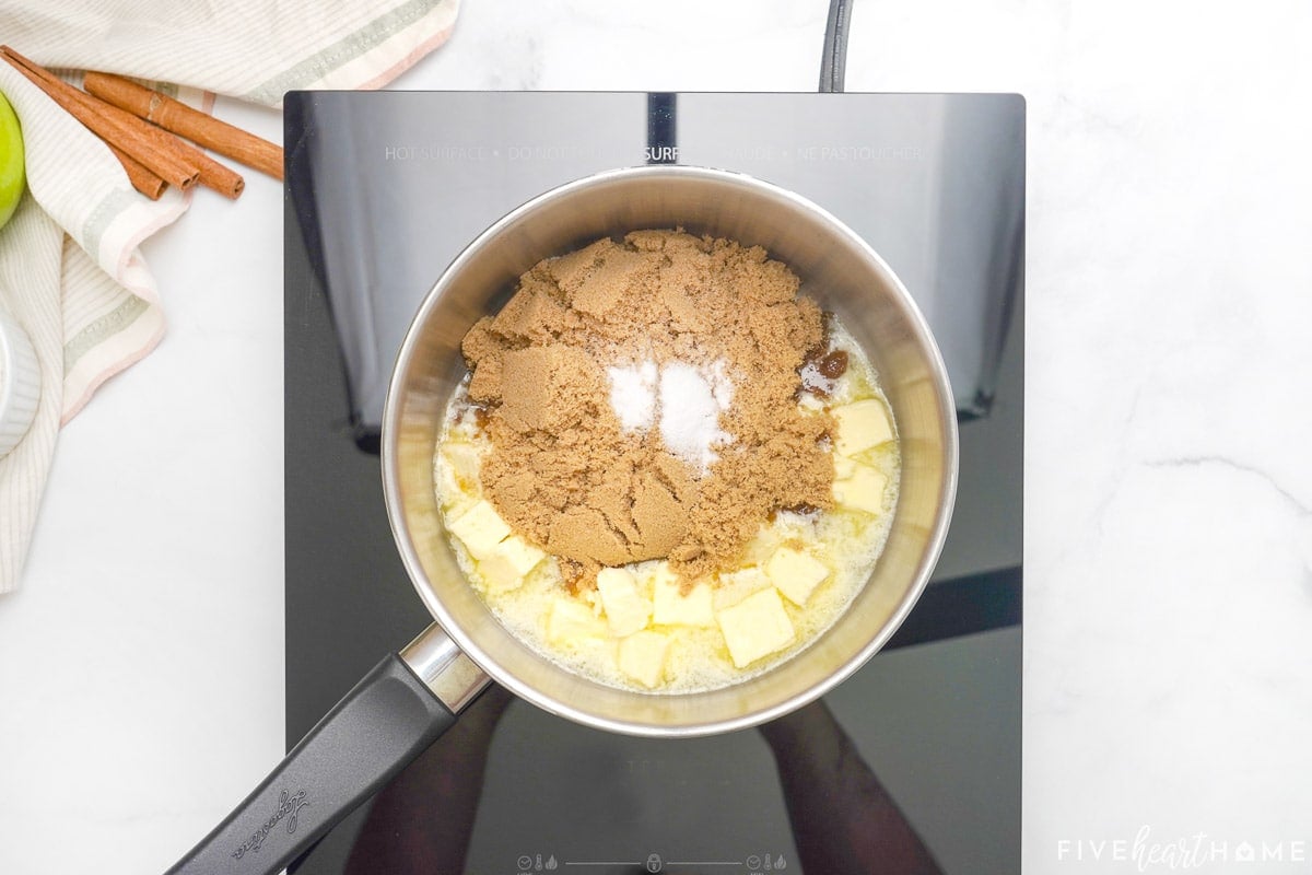 Mixing ingredients in pot for apple cake caramel glaze.