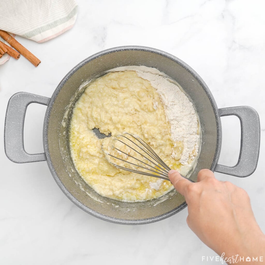 Whisking flour into pot.