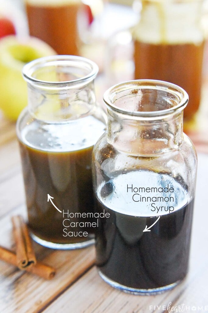 Jar of homemade caramel sauce and jar of homemade cinnamon syrup, both labeled.