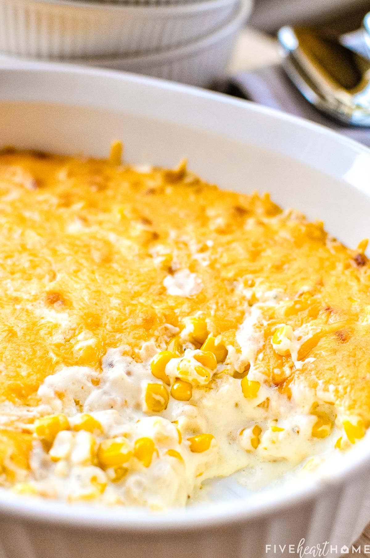Close-up of corn casserole recipe with missing scoop.