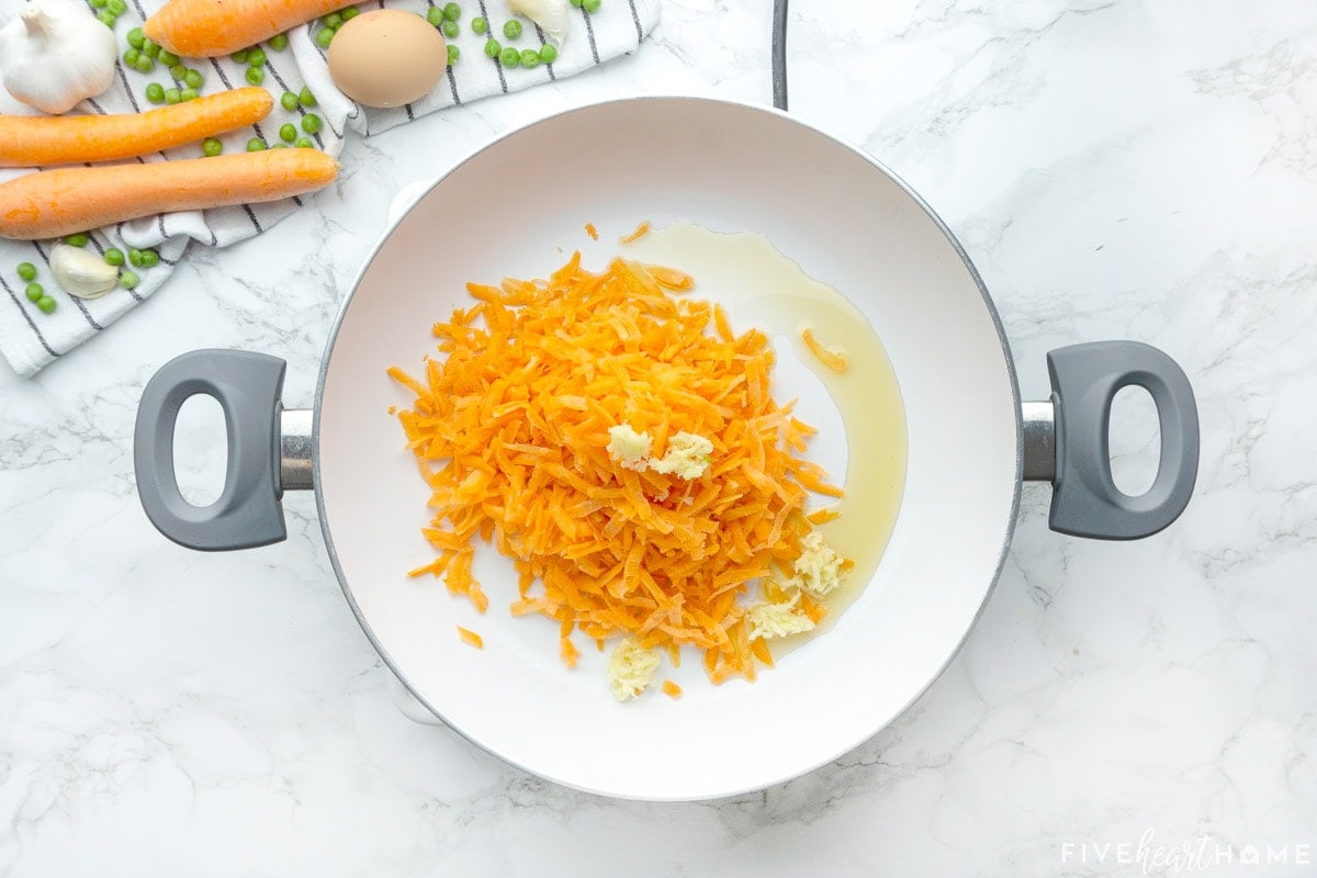 Carrots and garlic in pan with sesame oil.