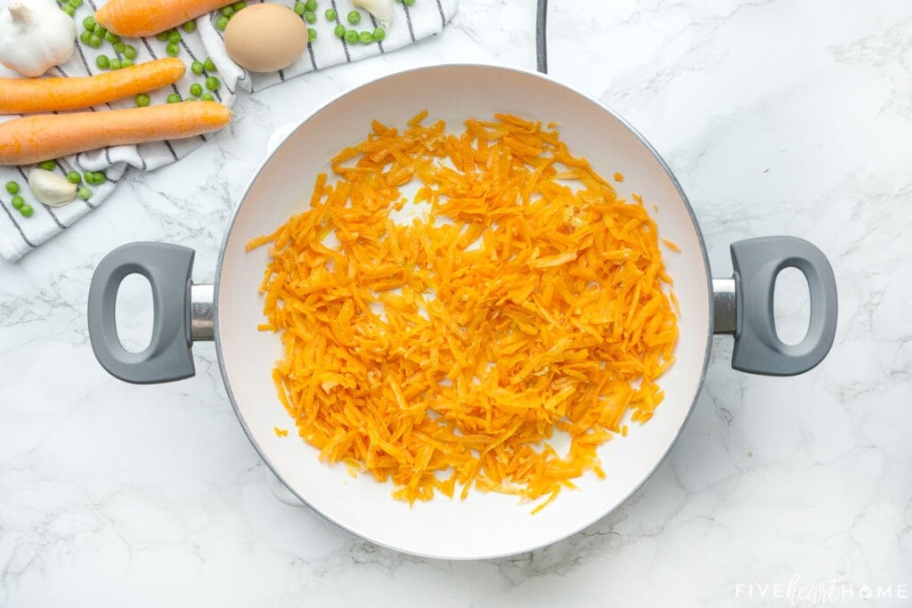 Cooking carrots until tender for Easy Fried Rice recipe.
