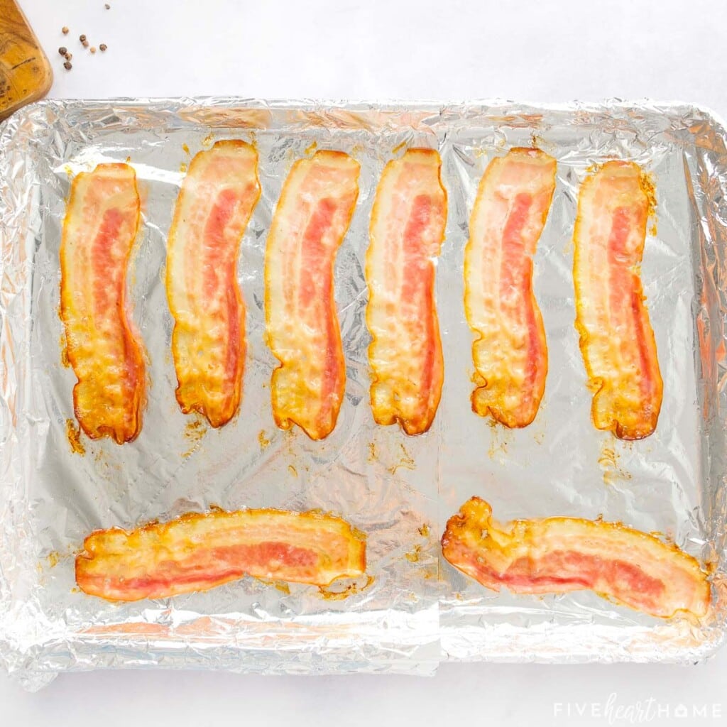 Cooked bacon on baking sheet.