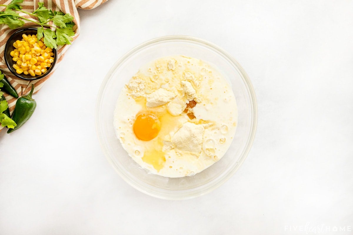 Ingredients for cornbread topping in glass bowl.