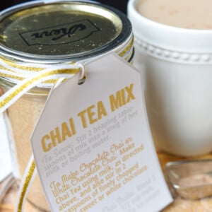 Chai tea mix in jar as homemade food gift and chai tea latte in mug.