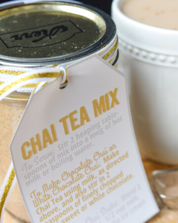 Chai tea mix in jar as homemade food gift and chai tea latte in mug.