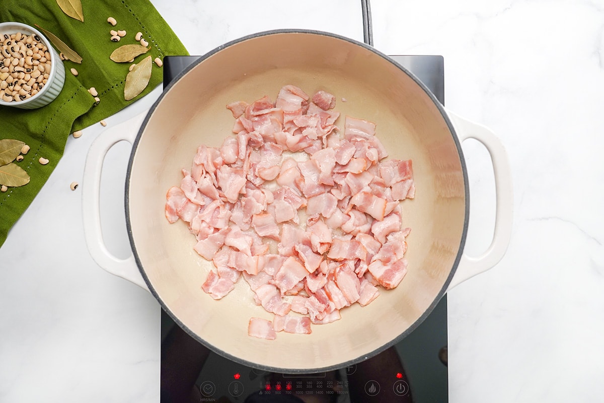 Browning cut bacon in large pot.