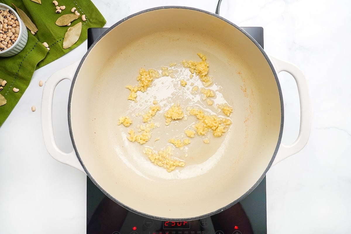 Sauteing garlic in pot.