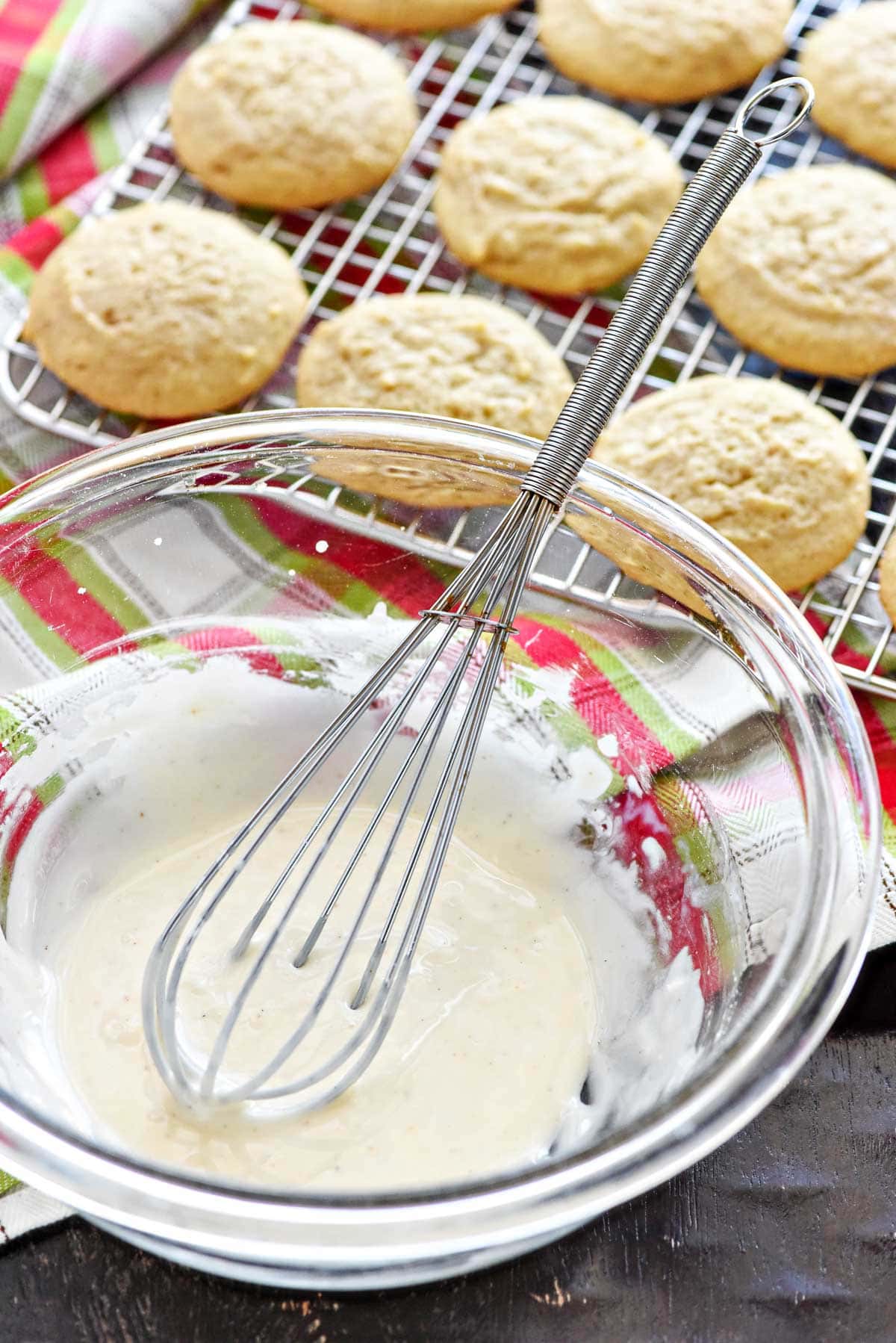 Eggnog glaze whisked together in bowl.