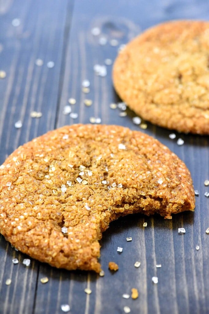 Ginger Cookies on table, one with missing bite.