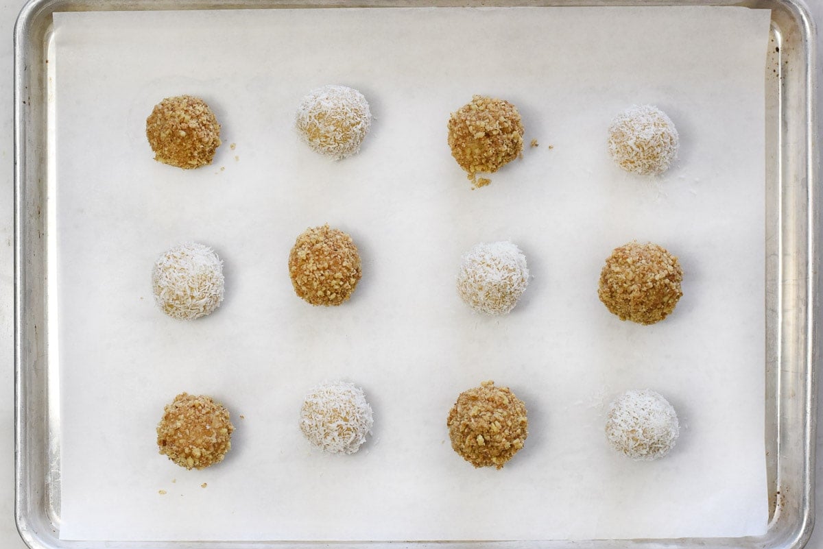 Jam Thumbprint Cookies on baking sheet ready to fill with jam.