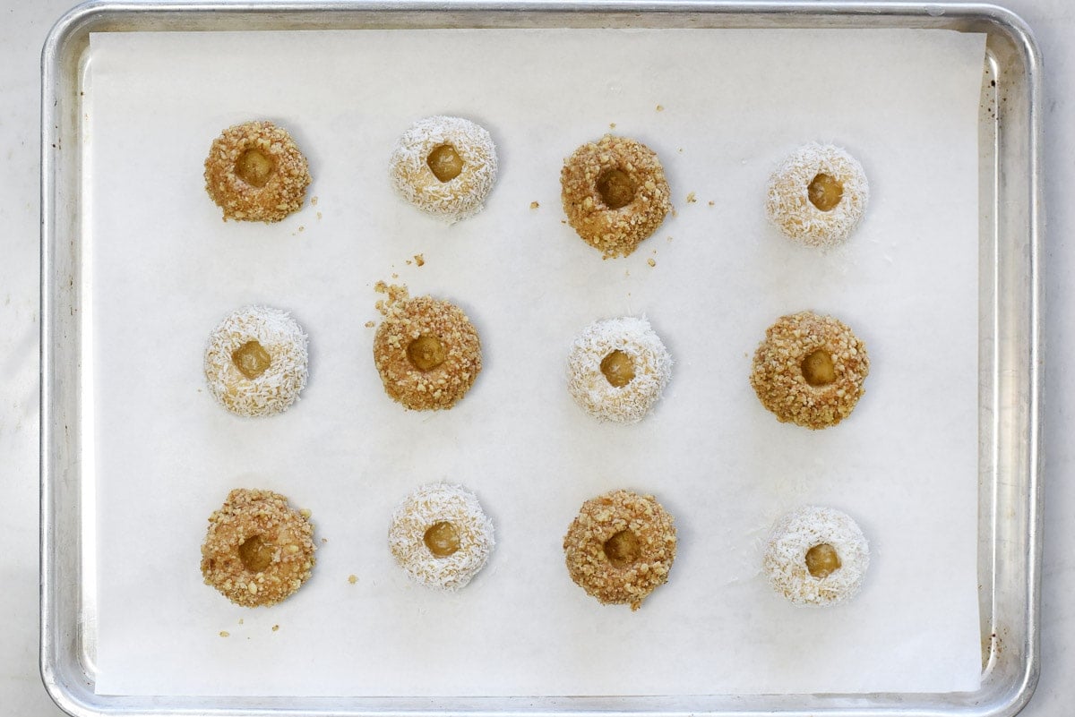 Jam Thumbprint Cookies on baking sheet before filling with jam.