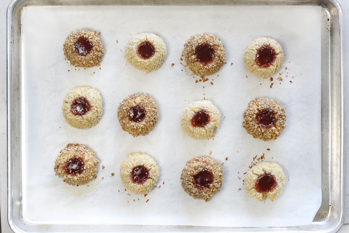 Jam Thumbprint Cookies on baking sheet, fresh out of oven.