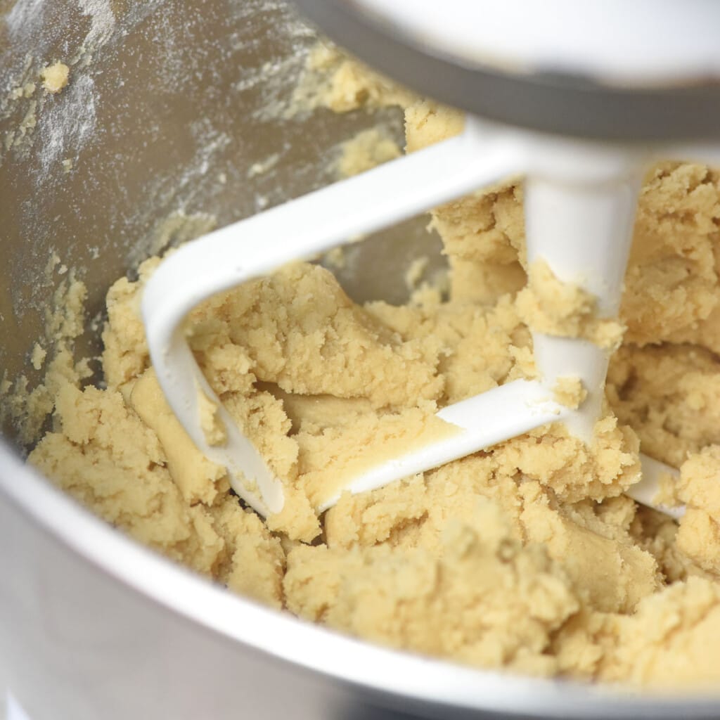 Cookie dough in bowl for thumbprint jam cookies.