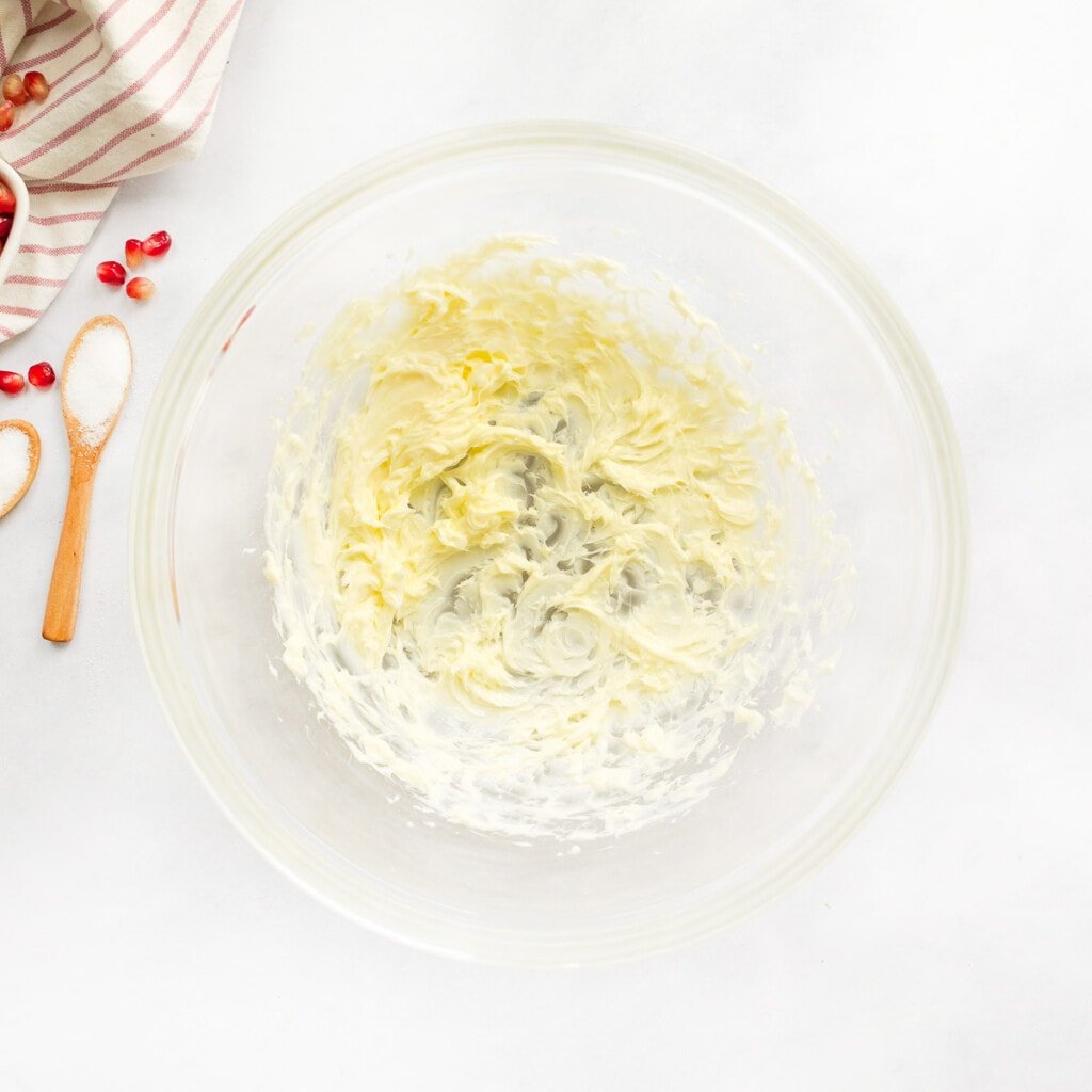 Creaming butter in bowl.