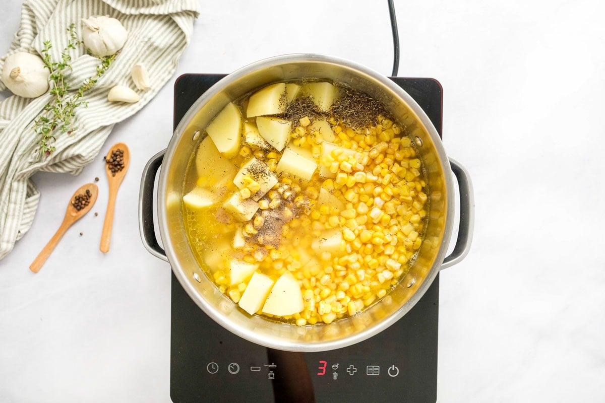 Potato Corn Chowder ingredients added to pot.