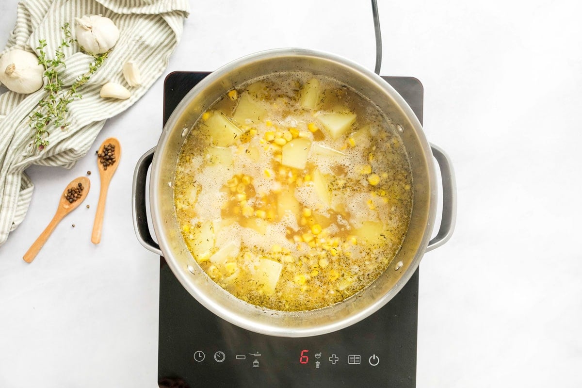 Potato Corn Chowder simmering on stove.