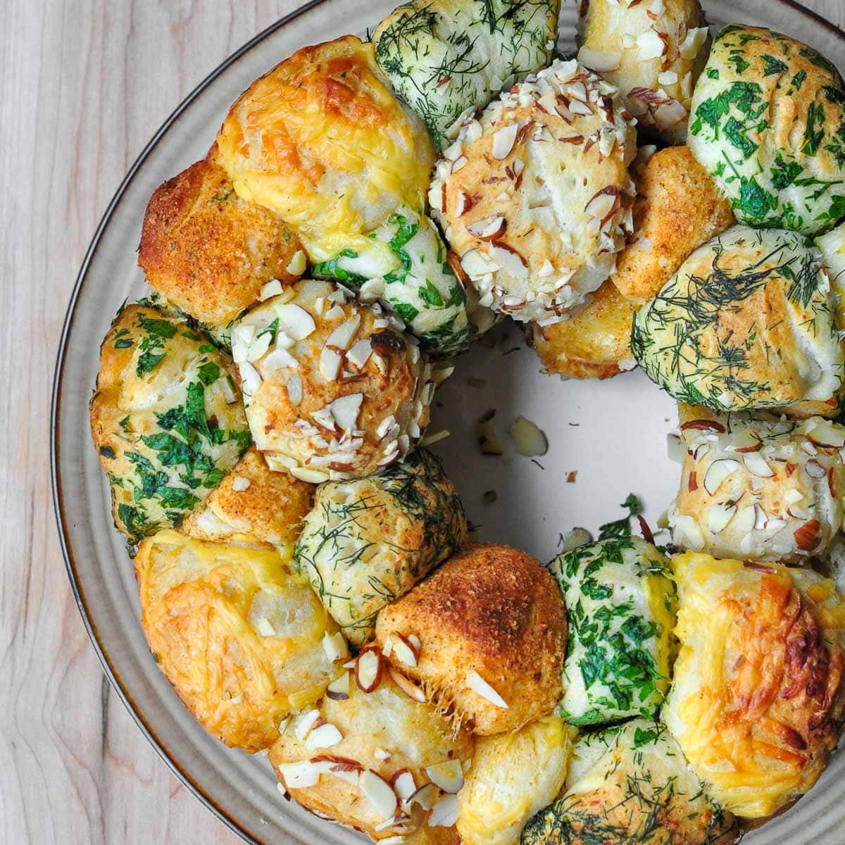 Savory Monkey Bread aerial view of monkey bread coated with herbs and cheese.