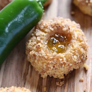 Savory Thumbprint Cookies with pepper jelly, cheddar, and nuts, plus a fresh jalapeño on the table.