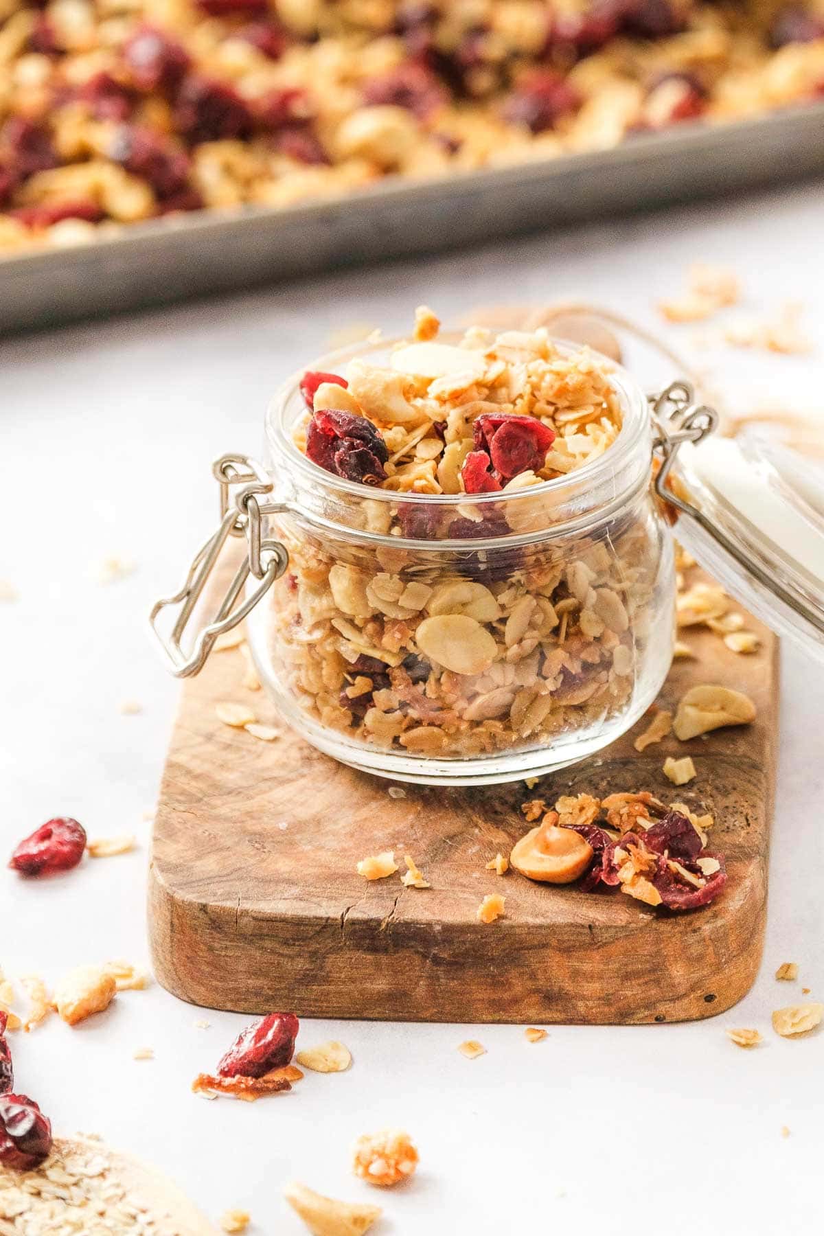 Granola cereal in glass jar.