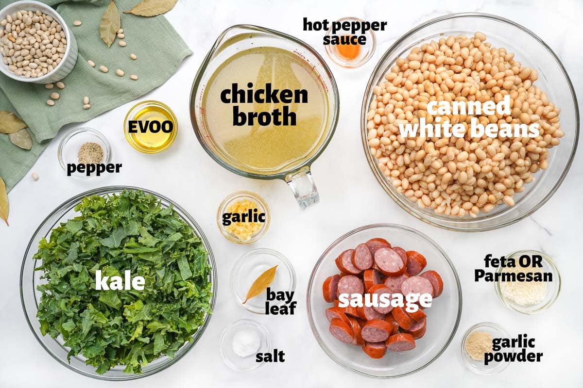 Labeled ingredients to make Sausage Kale White Bean Soup.