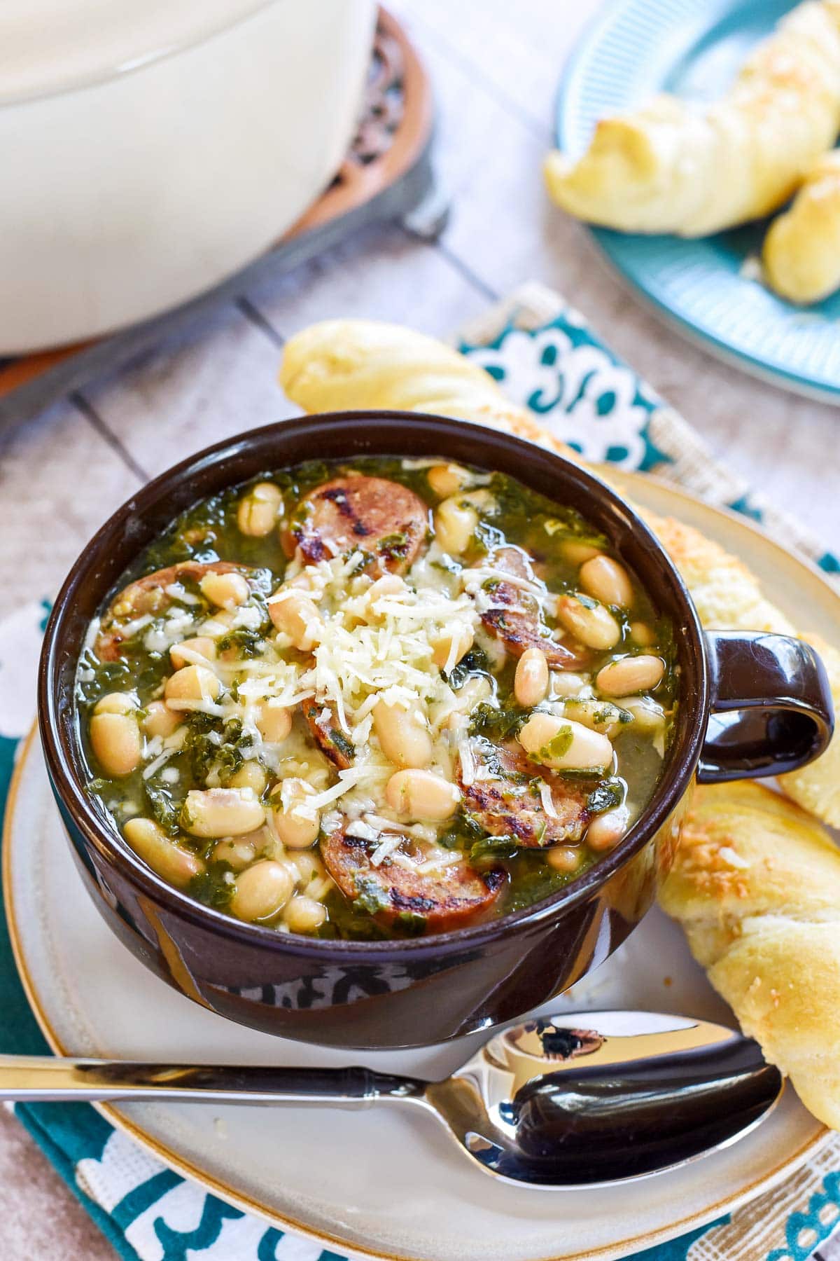 Sausage Kale White Bean Soup with breadsticks.