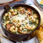 Sausage Kale White Bean Soup in brown bowl.