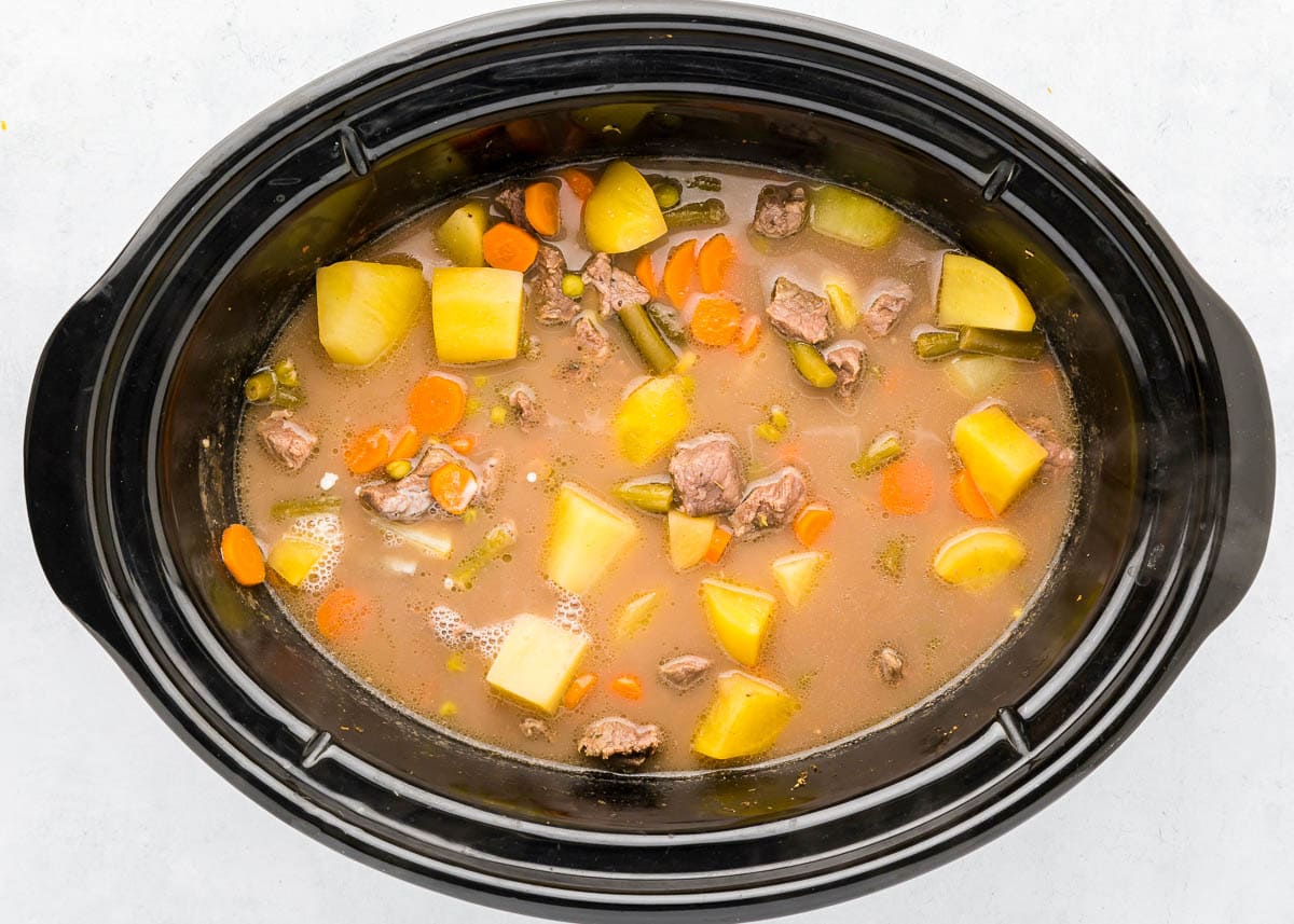 Finished beef stew crock pot recipe in slow cooker showing how to make beef stew in a crock pot.
