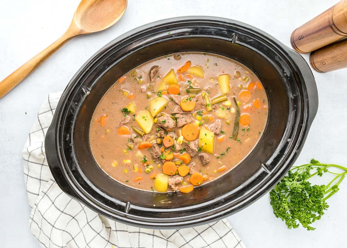 Aerial view of beef stew in a crock pot.