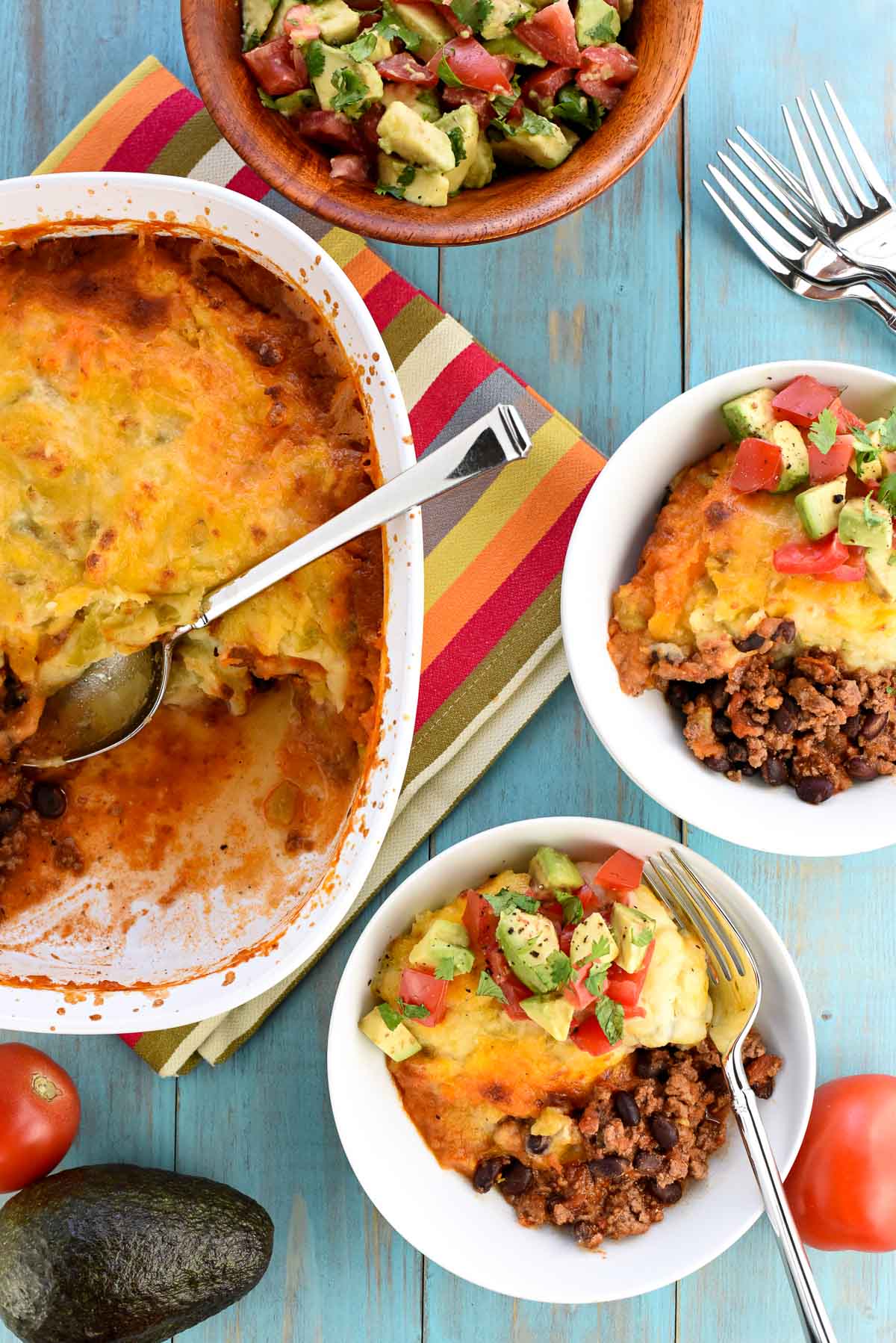 Aerial view of Taco Bake in casserole dish and serving bowls.