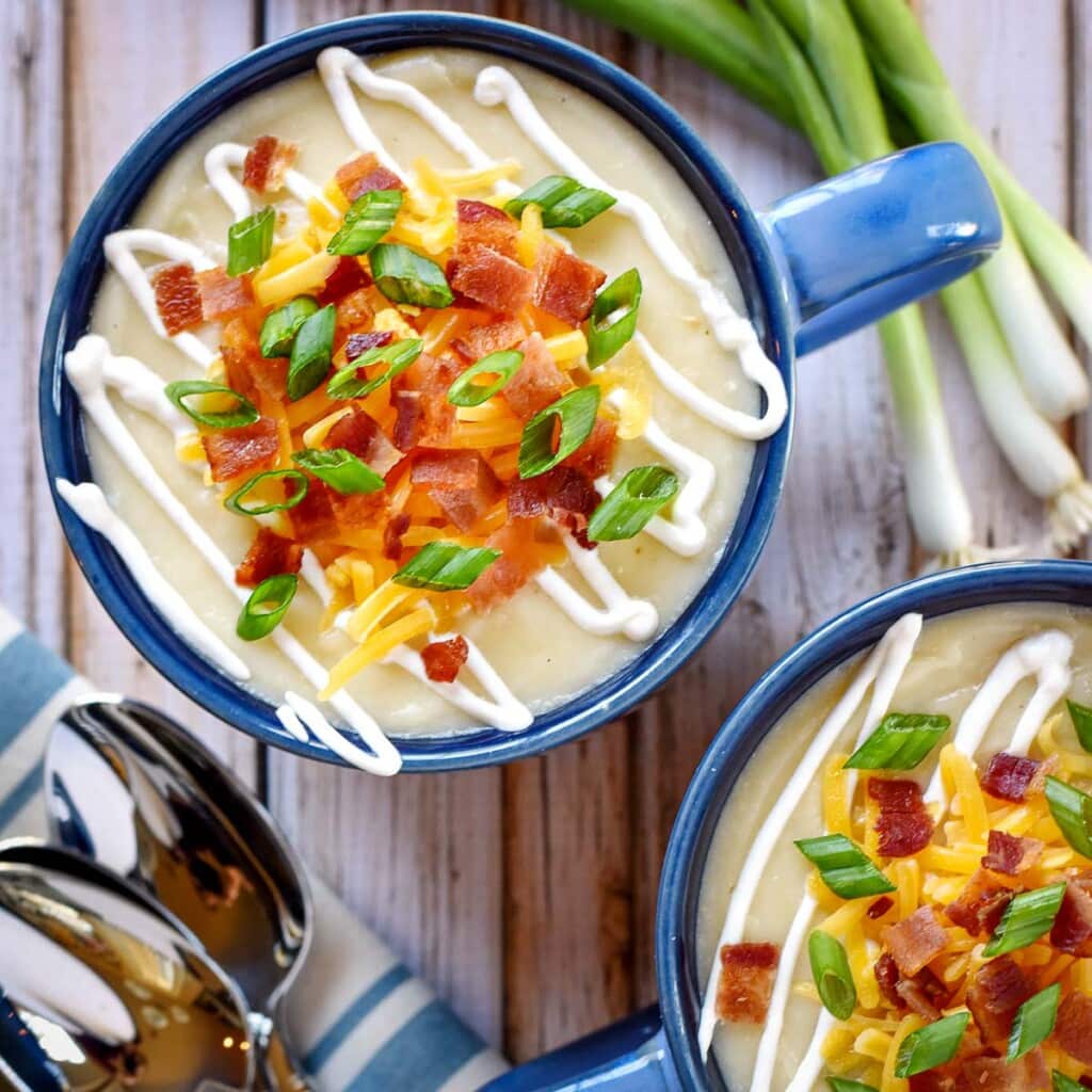 Aerial of Loaded Baked Potato Soup in two bowls.