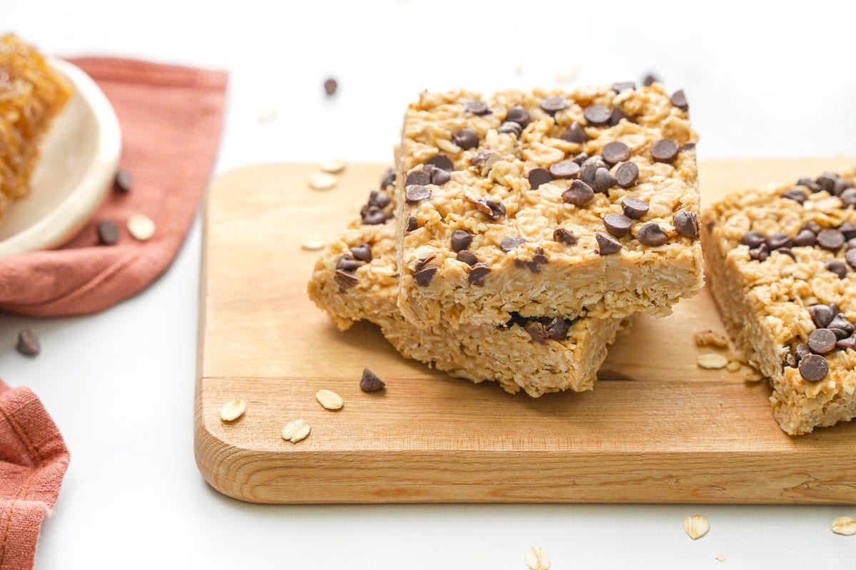 Chewy Granola Bars with oats sprinkled around.