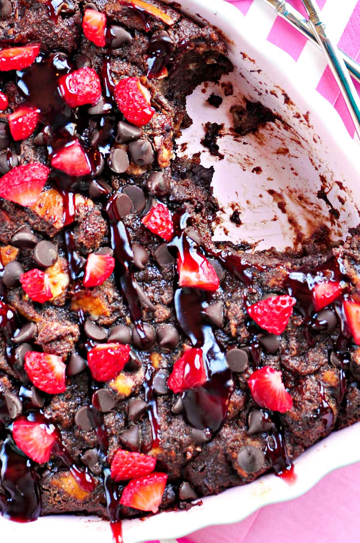 Chocolate Bread Pudding with raspberry sauce drizzled on top.