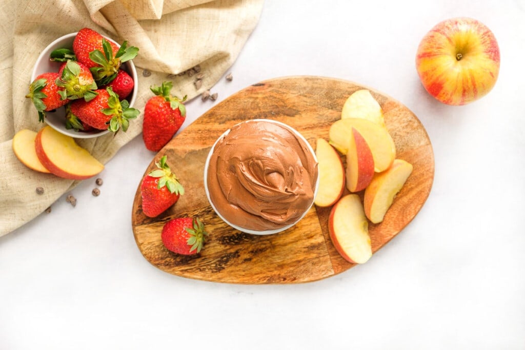 Aerial view of Chocolate Dip with strawberries and apples for dipping.