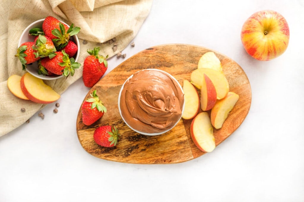 Aerial view of Chocolate Fruit Dip with strawberries and apples for dipping.