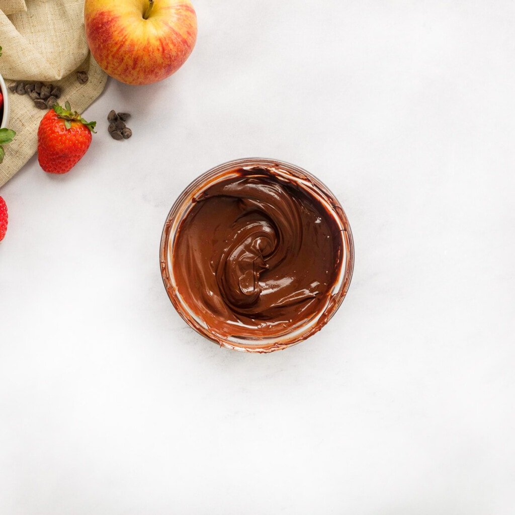 Melted chocolate chips to add to chocolate dip recipe.