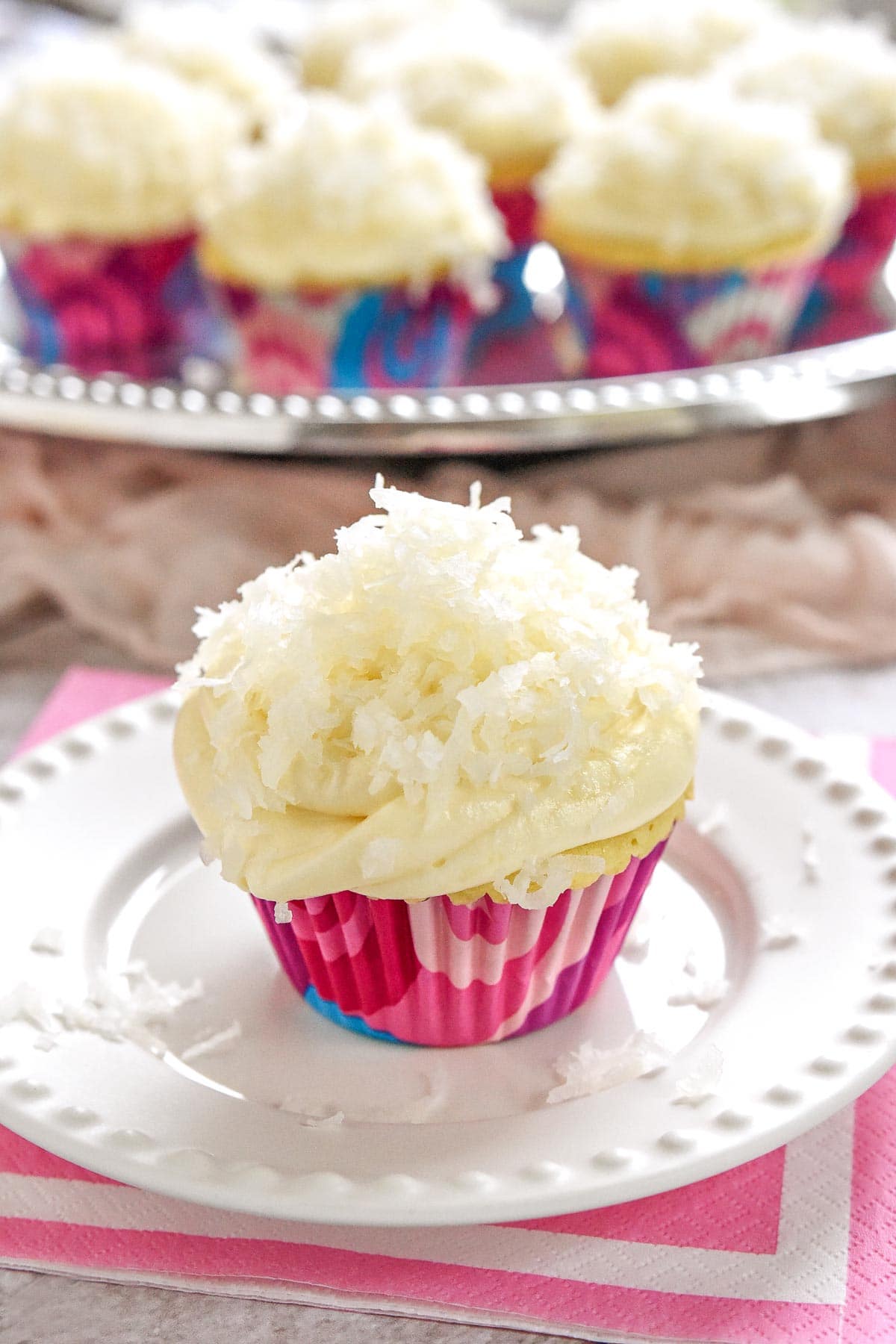 Coconut Cupcakes on plate and platter.