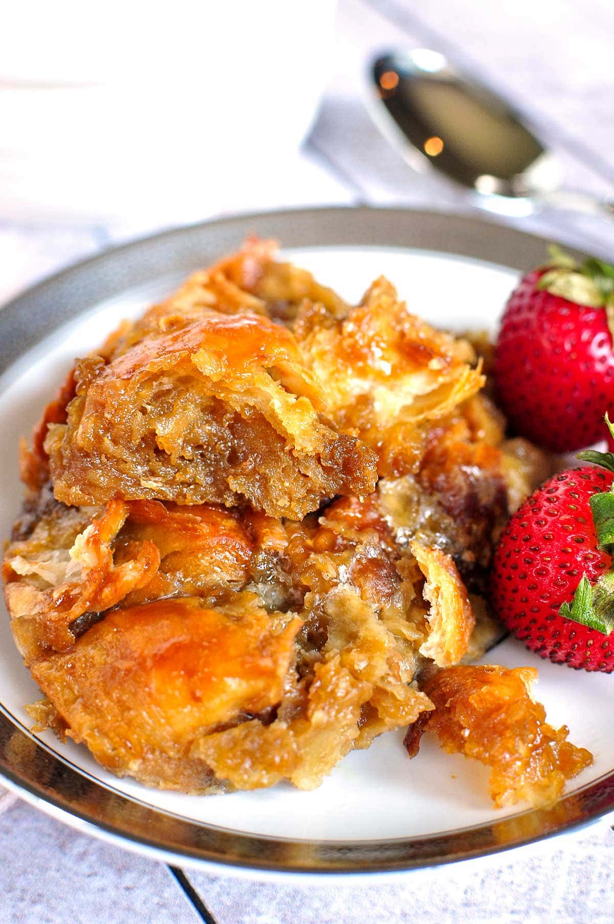 Serving of Croissant Bread Pudding on plate.