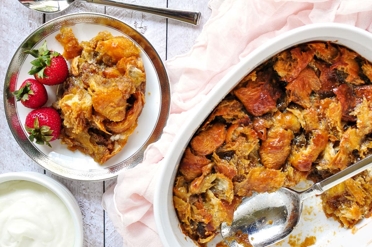 Aerial view of Croissant Bread Pudding on plate and in dish.