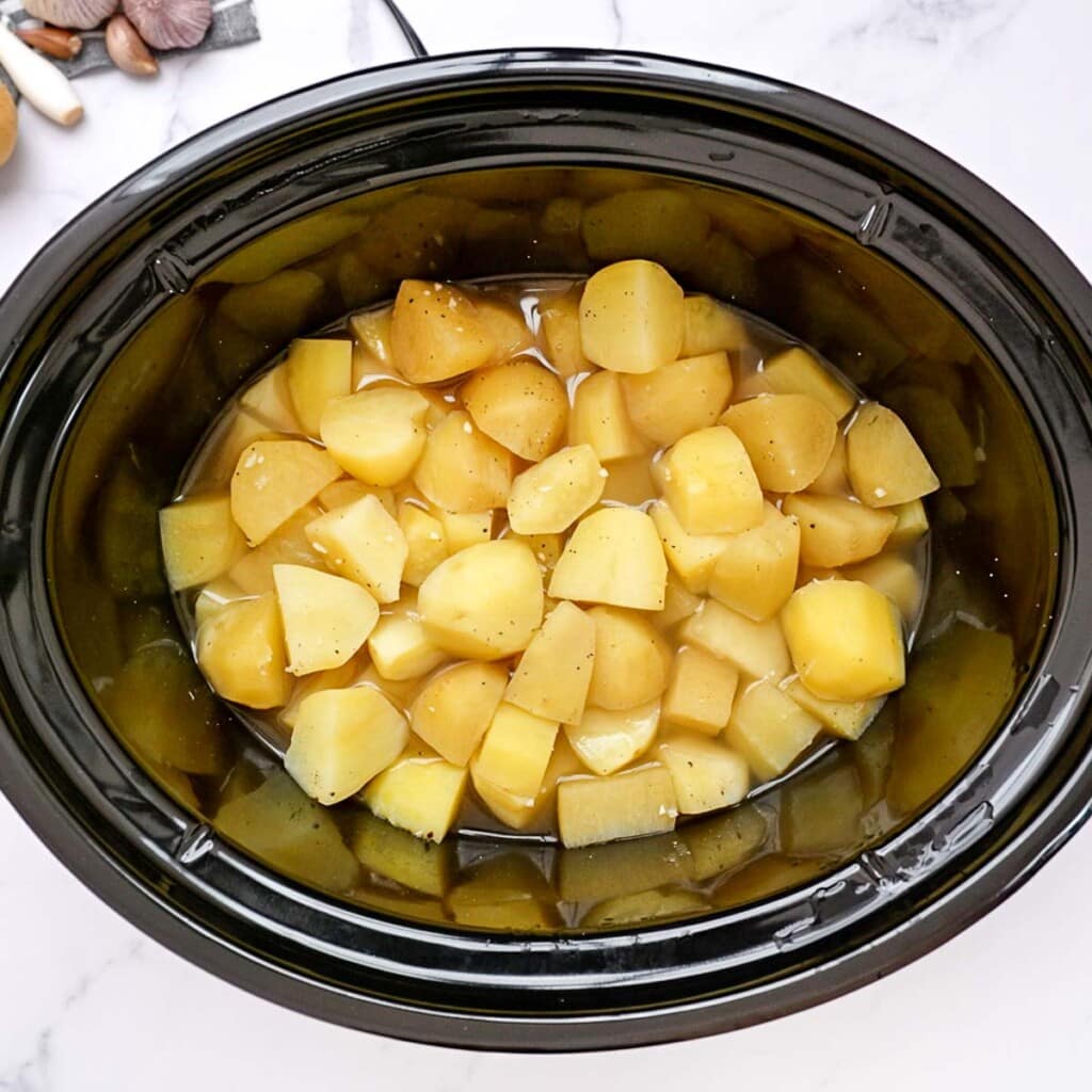 Ingredients combined for baked potato soup crock pot.