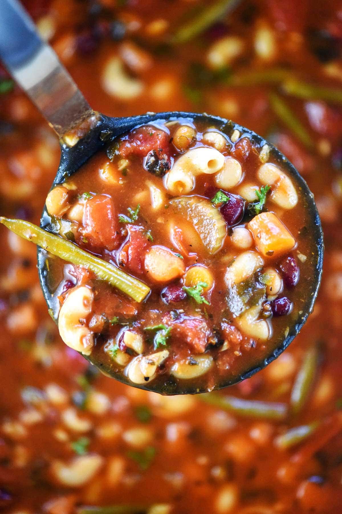 Aerial ladle of Minestrone Soup recipe.